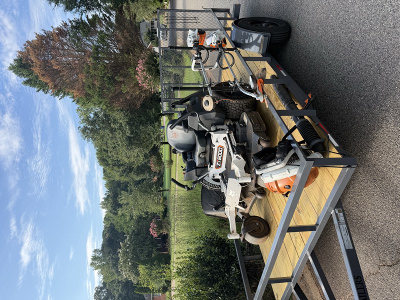 Pristine Landscaping mower and equipment trailer